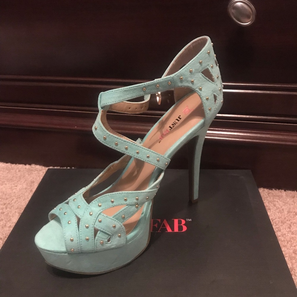 Light teal peep toe pumps